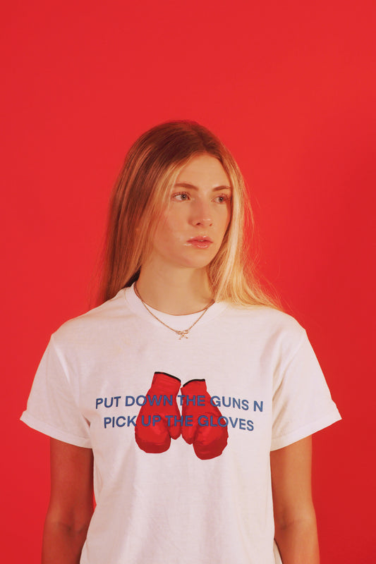 PUT DOWN THE GUNS N PICK UP THE GLOVES TEE [PRE-ORDER]