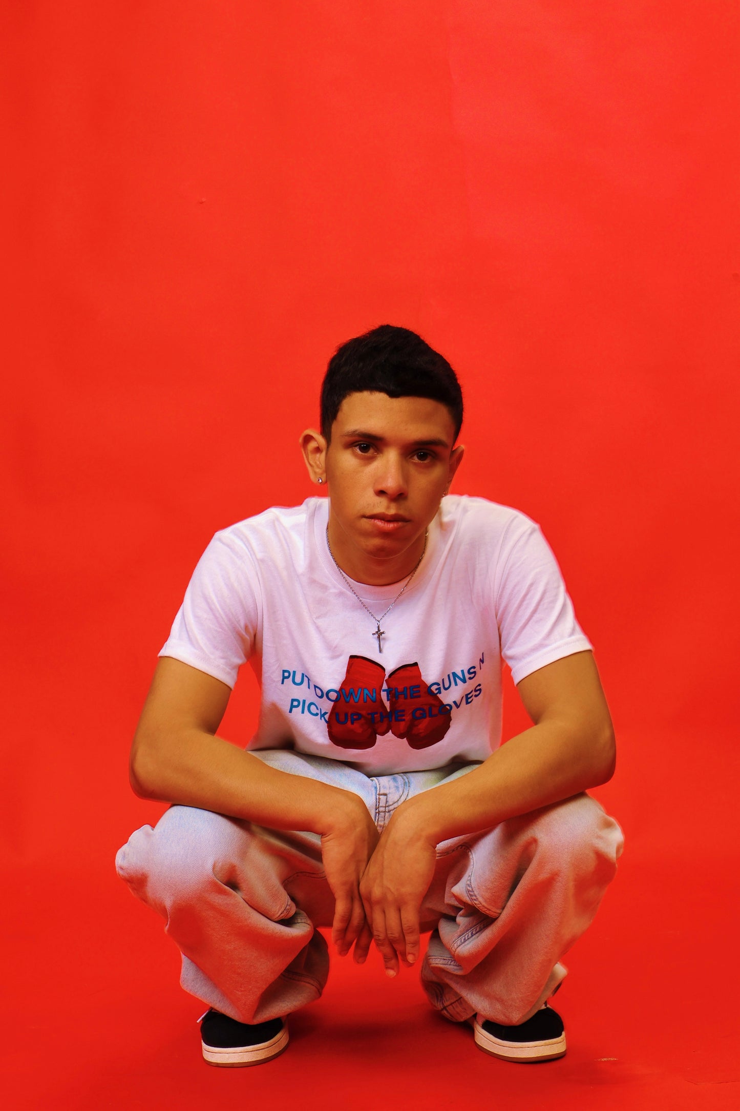 PUT DOWN THE GUNS N PICK UP THE GLOVES TEE [PRE-ORDER]