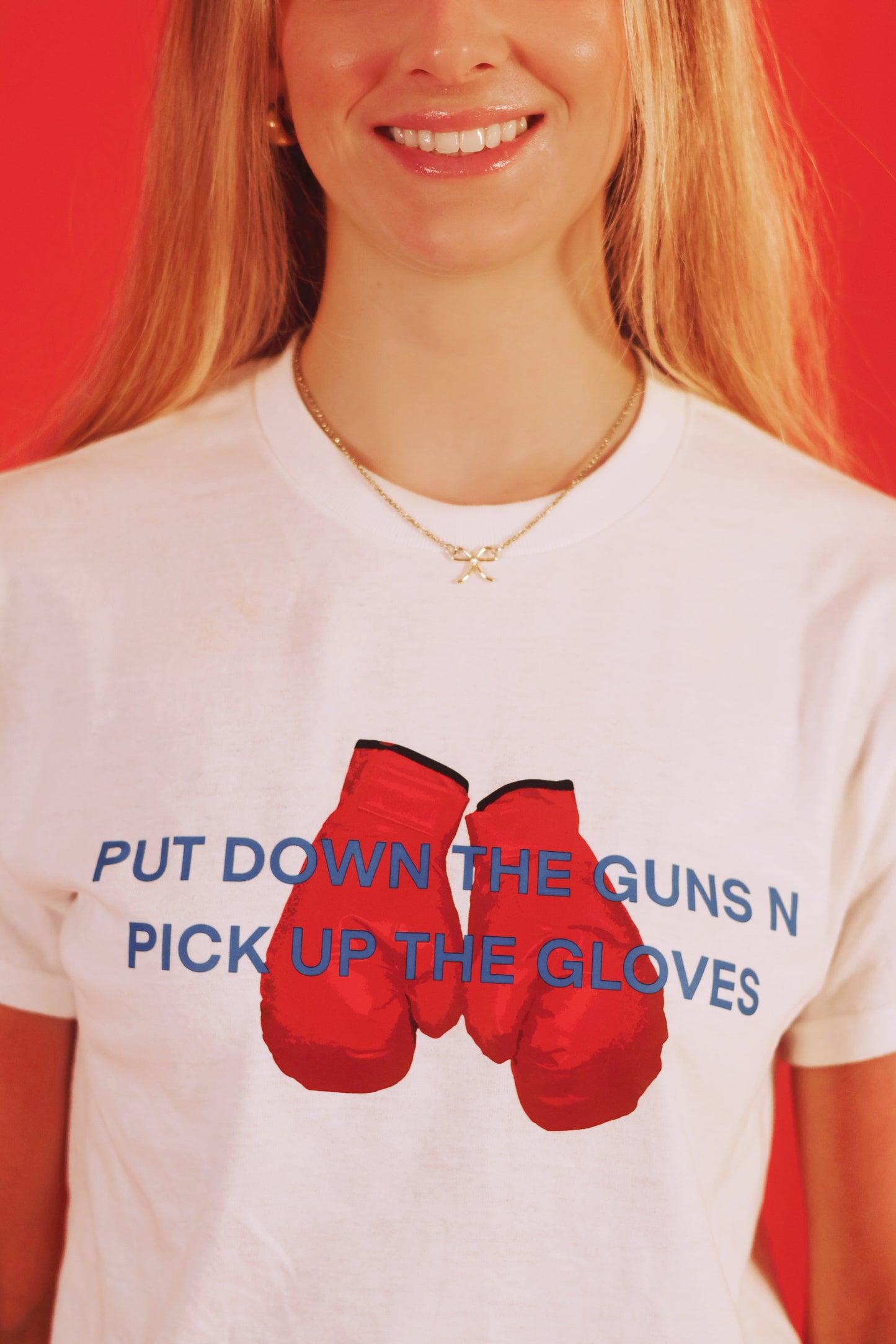 PUT DOWN THE GUNS N PICK UP THE GLOVES TEE [PRE-ORDER]