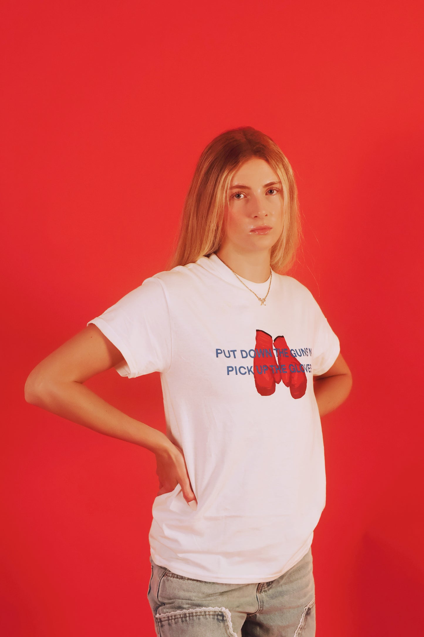 PUT DOWN THE GUNS N PICK UP THE GLOVES TEE [PRE-ORDER]